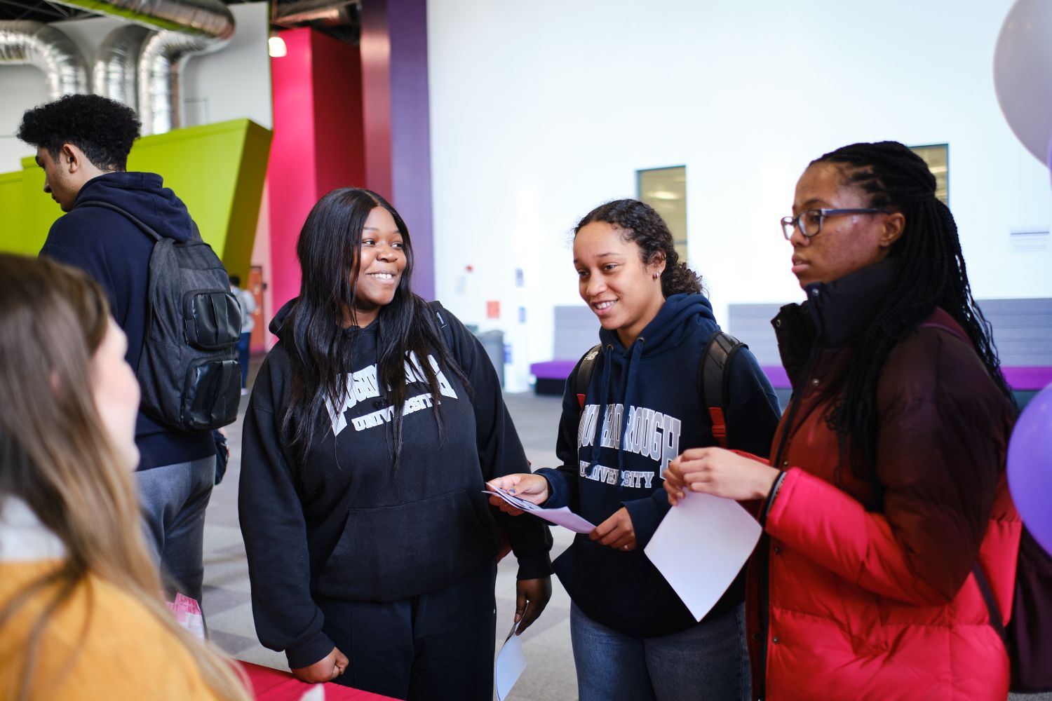 Three students at an event